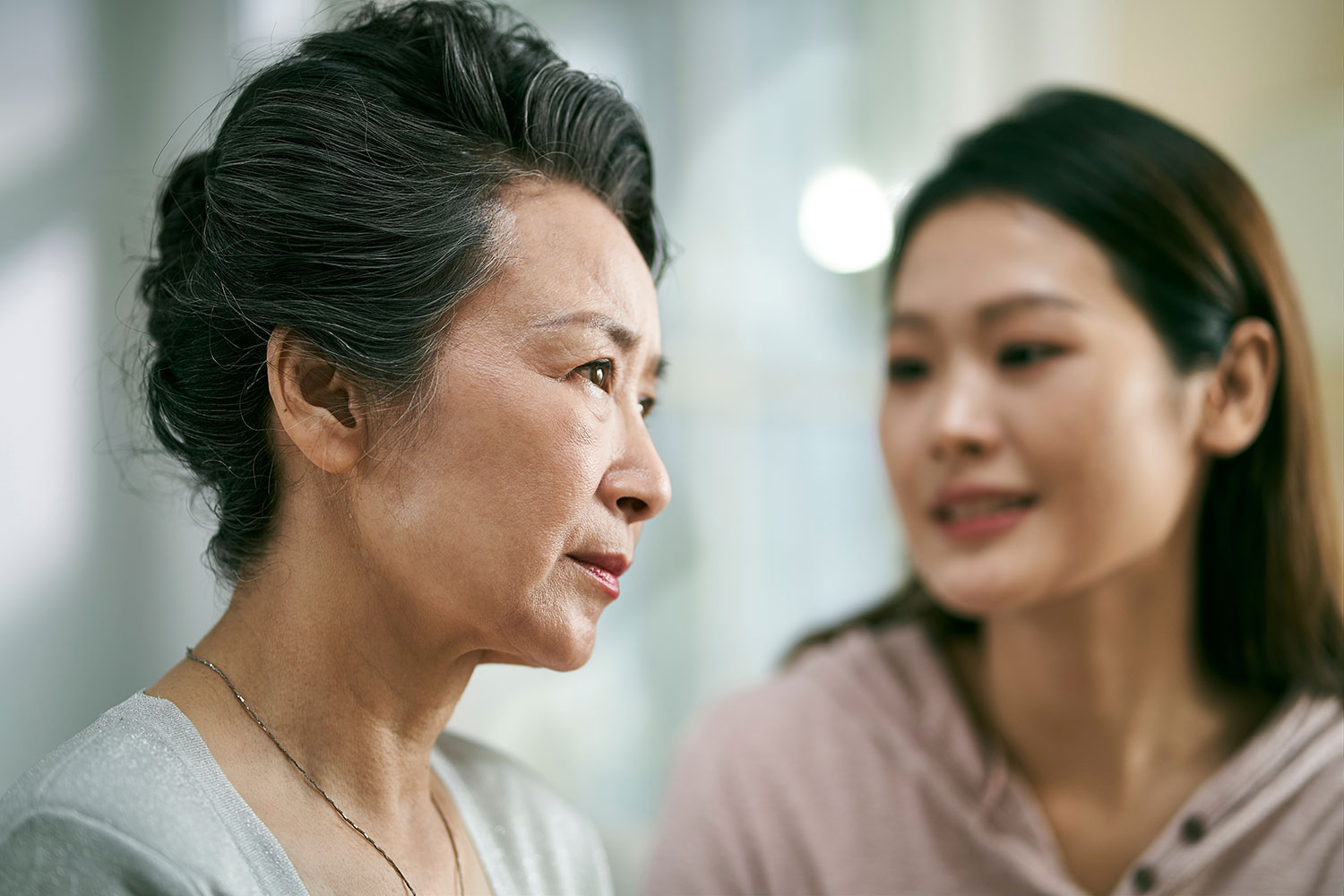daughter discussing early detection and prevention of Alzheimer's disease with mother