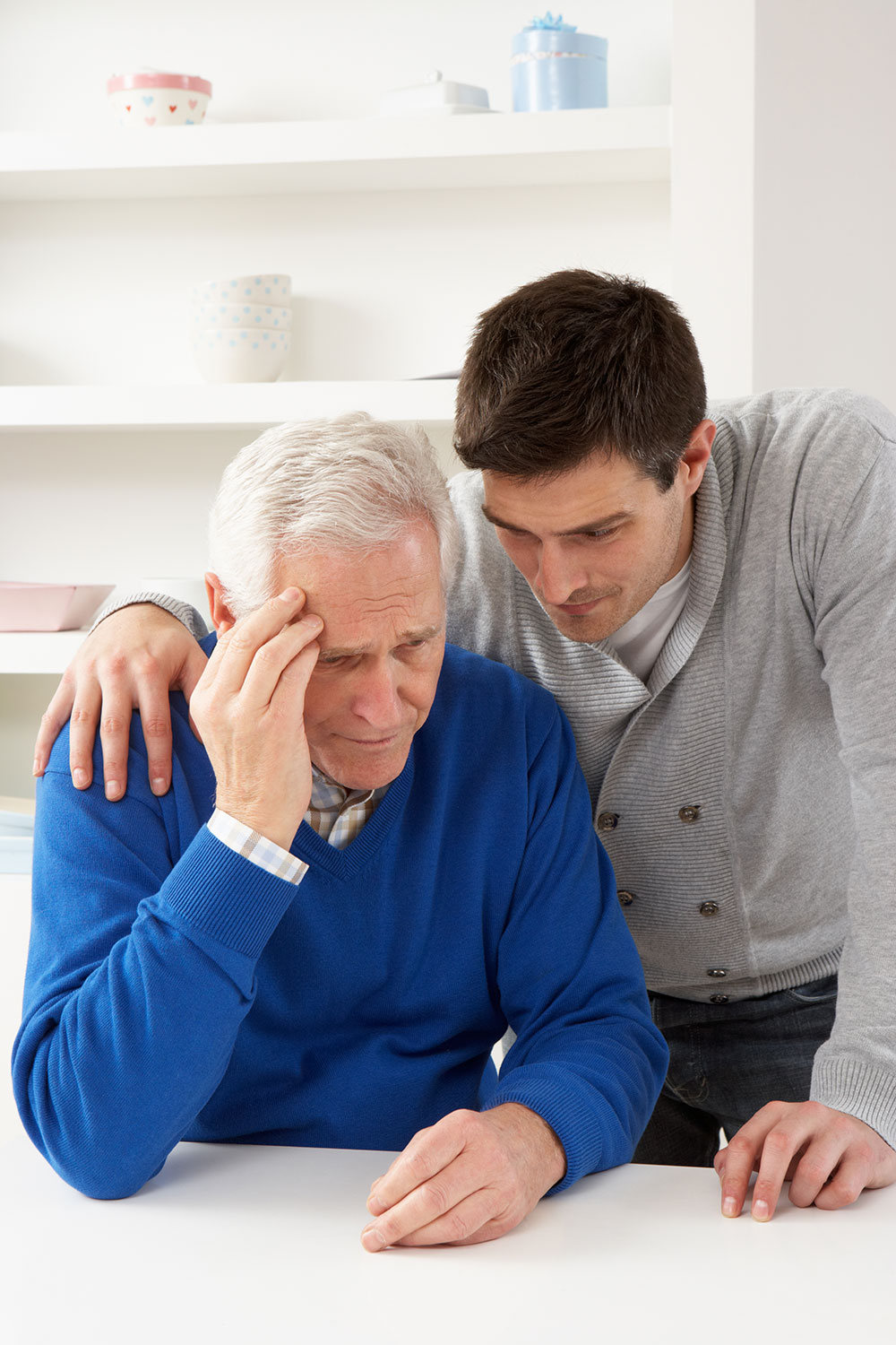 son with father with Dementia observing the disease progression